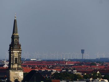 Buildings in city against sky