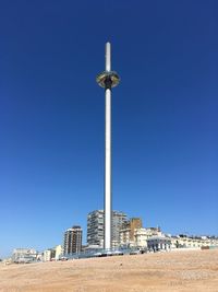 Low angle view of buildings against blue sky