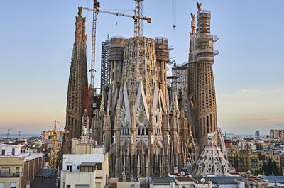 Panoramic view of buildings in city against sky