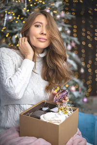 Portrait of young woman with christmas decoration