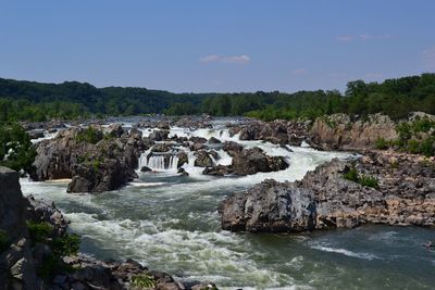 Scenic view of river flowing through rocks