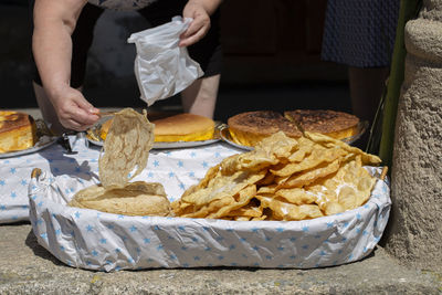 Midsection of man preparing food on table