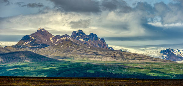 Scenic view of snowcapped mountains against sky