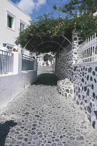 Footpath amidst buildings