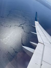 Airplane flying over clouds