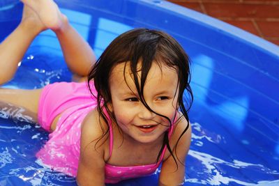 Portrait of smiling girl in swimming pool