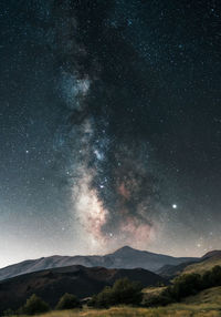 Scenic view of star field against sky at night