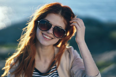 Portrait of young woman wearing sunglasses