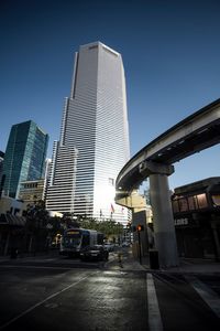 Low angle view of modern building against blue sky