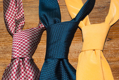 Close-up of multi colored shoes hanging on floor