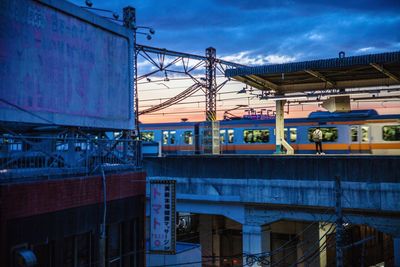 Train on bridge against sky