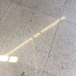 High angle view of rainbow on road