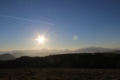 The beginning of the sunset in the mountains between colors and wild nature