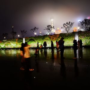 Woman jumping at night