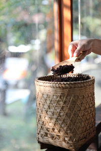 Close-up of hand holding ice cream basket