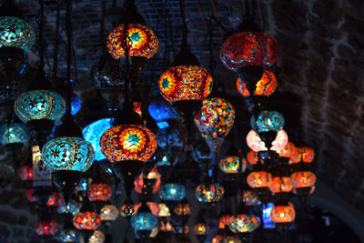 Close-up of illuminated lanterns hanging on ceiling