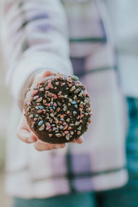 Close-up of hand holding ice cream cone