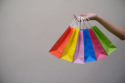 Close-up of multi colored umbrella against white background