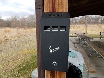 Close-up of information sign on field