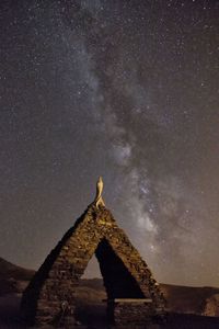 Low angle view of building against sky at night