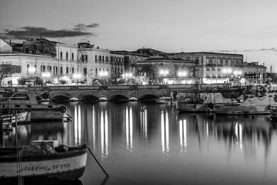 Reflection of illuminated buildings in water