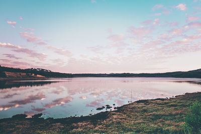 Scenic view of lake against sky during sunset