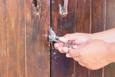 Cropped hands opening lock