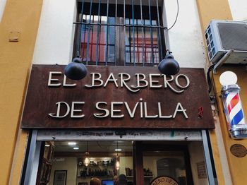 Low angle view of information sign on building