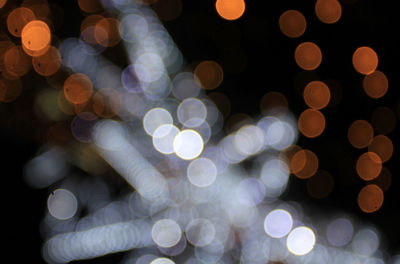 Defocused image of illuminated lights at night