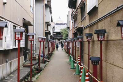 Narrow alley amidst buildings in city