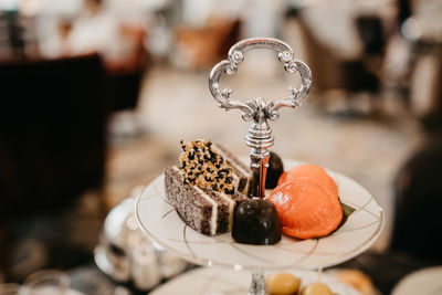 High angle view of cakes and pastries on tiered stand