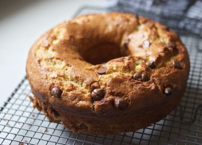 Freshly baked cake cools on a bench in the kitchen.