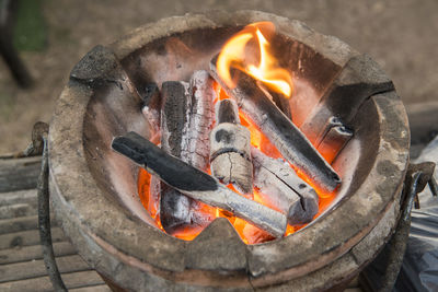 High angle view of fire on wood