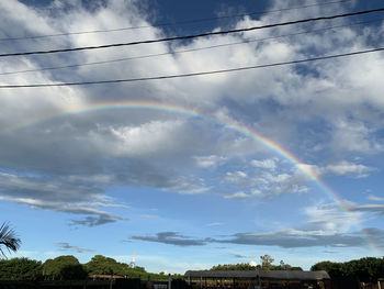 Low angle view of rainbow against sky