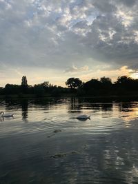 Scenic view of lake against sky during sunset