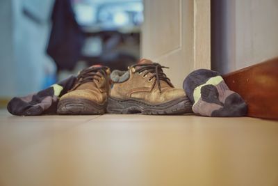 Close-up of shoes on table at home