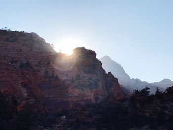 Scenic view of cliff against clear sky