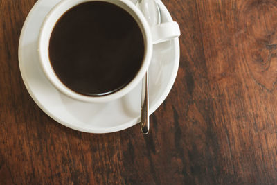 High angle view of coffee cup on table