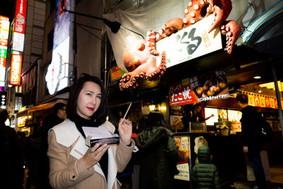 Woman standing at market stall