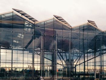 Low angle view of modern building against sky