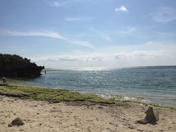 Scenic view of beach against sky