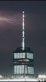 Low angle view of skyscrapers lit up at night