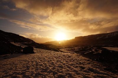 Scenic view of mountains against sky during sunset