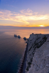 Scenic view of sea against sky at sunset