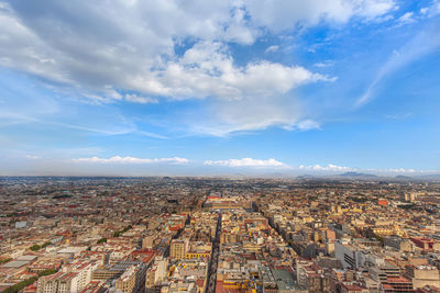 High angle view of city against cloudy sky