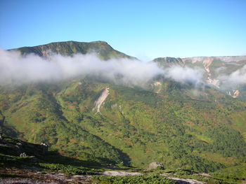 Scenic view of waterfall against clear sky