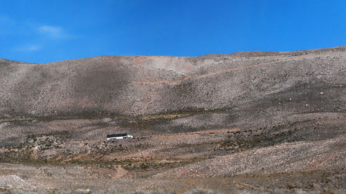 Scenic view of landscape against blue sky