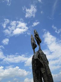 Low angle view of statue against sky