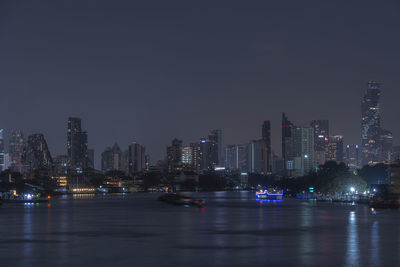 Illuminated buildings in city at night