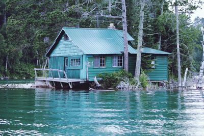 Calm sea with buildings in background